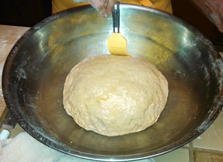 Oiling the dough.