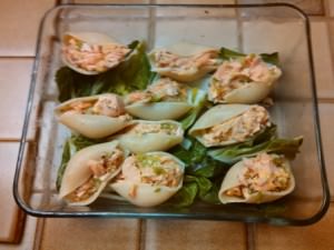 Salmon filled pasta shells on a bed of bok choy