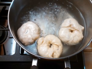 Bagels in a boiling water bath.