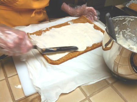 Covering cake with the filling.